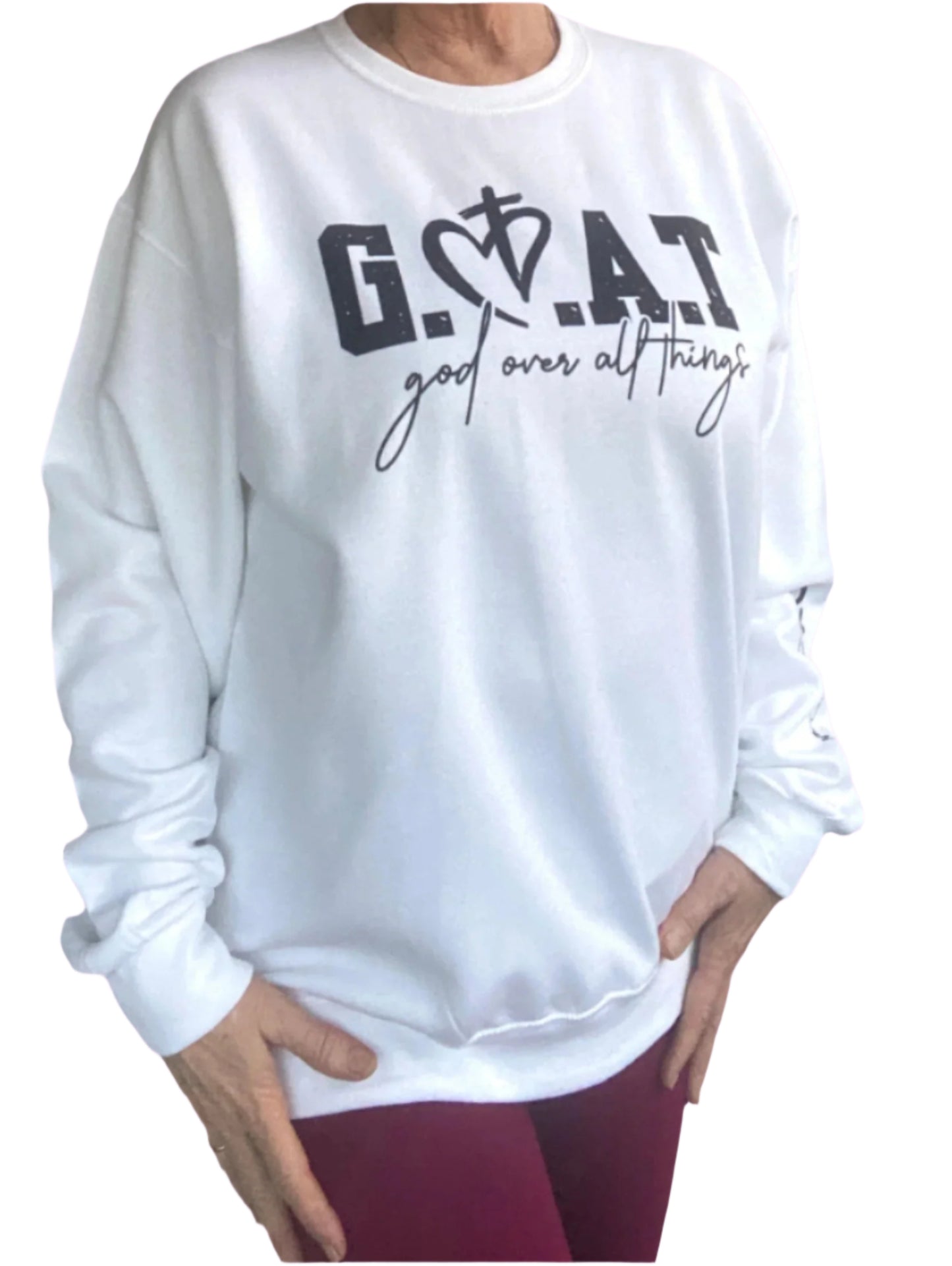 White sweatshirt with image on front "G.O.A.T. God Over All Things" and on the left sleeve "Debate Over"