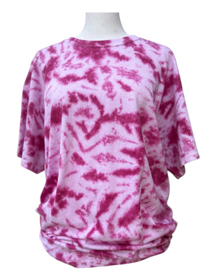 Pink and white tie-dye pattern of a short sleeve t-shirt on a mannequin